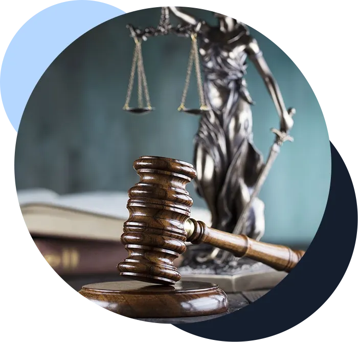 Gavel in front of legal scales